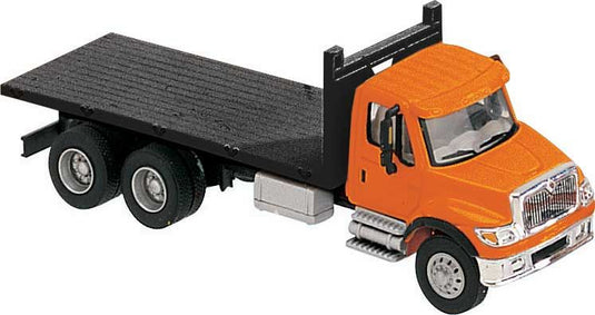 Walthers SceneMaster HO International 7600 3-Axle Flatbed Truck - Orange Cab Black Flatbed